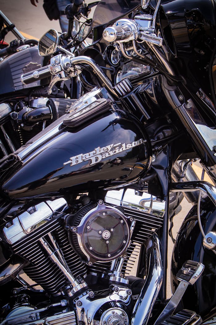 Detailed view of a Harley Davidson motorcycle engine showcasing chrome parts and logo.